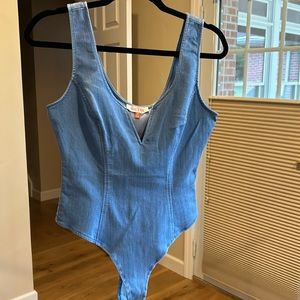 Denim thong body suit, soft denim, cotton/rayon/spandex mix.  Wire in ‘V’ shape.